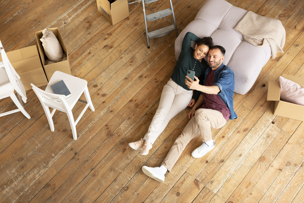 people laying on hardwood floors