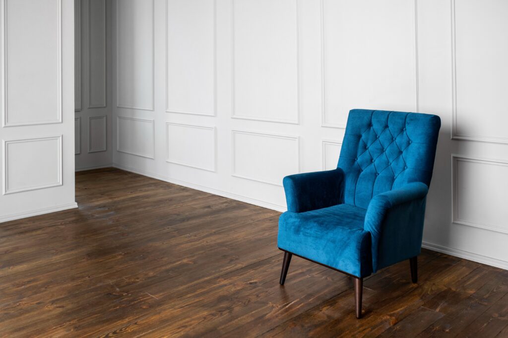 blue chair on hardwood floors